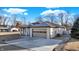 Exterior view of the single story home featuring a gray brick exterior and attached garage at 201 S Mckinley St, North Salem, IN 46165