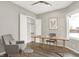 Bright home office featuring built-in shelving and a desk at 201 S Mckinley St, North Salem, IN 46165