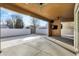Spacious covered patio featuring a ceiling fan, TV, and concrete flooring at 201 S Mckinley St, North Salem, IN 46165