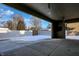 Covered patio with brick walls and concrete flooring at 201 S Mckinley St, North Salem, IN 46165