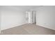 Neutral bedroom showcasing plush carpeting, ample natural light, and an open doorway to the closet at 2310 Marjorie Way, Shelbyville, IN 46176