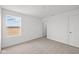Bright bedroom with neutral carpet, white walls, and a window view at 2310 Marjorie Way, Shelbyville, IN 46176