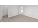 Comfortable bedroom featuring soft carpeting, bright natural light, and easy access to the walk-in closet at 2310 Marjorie Way, Shelbyville, IN 46176