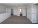 Spacious carpeted hallway that features multiple entryways and a window at 2310 Marjorie Way, Shelbyville, IN 46176