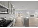 Modern kitchen featuring stainless appliances, light grey cabinets, quartz countertops and LVP flooring at 2310 Marjorie Way, Shelbyville, IN 46176