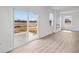 Living room featuring luxury vinyl plank flooring, with sliding door and electric fireplace at 2310 Marjorie Way, Shelbyville, IN 46176