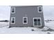 Rear exterior view of home with gray siding, white trim, windows and a sliding glass door at 2310 Marjorie Way, Shelbyville, IN 46176