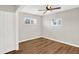 Spacious bedroom featuring wood floors and a ceiling fan at 2319 N Rural St, Indianapolis, IN 46218