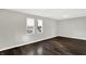 Bright bedroom with dark hardwood floors and neutral walls at 2319 N Rural St, Indianapolis, IN 46218