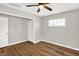 Well-lit bedroom, featuring wood-look floors and a closet at 2319 N Rural St, Indianapolis, IN 46218