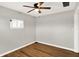 Simple bedroom with ceiling fan and wood-look flooring at 2319 N Rural St, Indianapolis, IN 46218