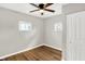 Bright bedroom with ceiling fan and wood-look flooring at 2319 N Rural St, Indianapolis, IN 46218