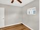 Bright bedroom with wood-look floors and ceiling fan at 2319 N Rural St, Indianapolis, IN 46218