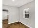 Simple dining room with light gray walls and wood-look flooring at 2319 N Rural St, Indianapolis, IN 46218