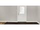 Interior entryway with dark hardwood floors and white door at 2319 N Rural St, Indianapolis, IN 46218