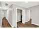 Hallway with light gray walls and wood-look flooring at 2319 N Rural St, Indianapolis, IN 46218
