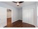 Bright bedroom with wood floors, ceiling fan, and double door closet at 2320 Spann Ave, Indianapolis, IN 46203