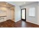 Bright entryway with built-in bench, dark hardwood floors, and exterior access at 2320 Spann Ave, Indianapolis, IN 46203