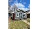 Attractive single-story home showcasing gray siding and manicured landscaping at 2320 Spann Ave, Indianapolis, IN 46203