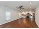 Modern kitchen with white cabinets, stainless steel appliances, and dark wood flooring at 2320 Spann Ave, Indianapolis, IN 46203