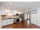 Updated kitchen with white cabinets, granite countertops, and stainless steel appliances at 2320 Spann Ave, Indianapolis, IN 46203