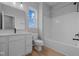 Bright bathroom with shower-tub combination, a vanity, and wood-look floors at 3617 Wrangler Dr, Bargersville, IN 46106
