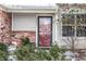 Red front door entryway with brick and siding accents at 4243 Twilight Dr, Indianapolis, IN 46254