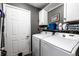 Bright laundry room, featuring washer, dryer, and ample storage at 4243 Twilight Dr, Indianapolis, IN 46254