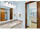 Bathroom featuring dual access to the bathtub, lots of counter space, and vanity with great lighting at 4669 Stansbury Ln, Indianapolis, IN 46254