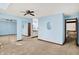 Carpeted bedroom featuring a ceiling fan, closet, bathroom, and stairway at 4669 Stansbury Ln, Indianapolis, IN 46254