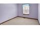 Cozy bedroom with window and neutral decor at 4669 Stansbury Ln, Indianapolis, IN 46254