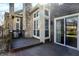Back deck with stone chimney and sliding glass door to yard at 4669 Stansbury Ln, Indianapolis, IN 46254