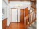 Hardwood floors, white door, and wooden staircase at 4669 Stansbury Ln, Indianapolis, IN 46254