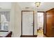 Bright entryway features hardwood floors, a window and a full bathroom view at 4669 Stansbury Ln, Indianapolis, IN 46254