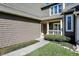 Inviting front entrance featuring a charming front door, trimmed shrubbery and manicured lawn at 4669 Stansbury Ln, Indianapolis, IN 46254