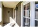 Charming front porch with lantern lighting fixture and decorative door mat at 4669 Stansbury Ln, Indianapolis, IN 46254