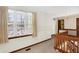 Bright hallway with large window and wood railing at 4669 Stansbury Ln, Indianapolis, IN 46254