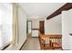 Hallway features a wooden railing, neutral carpeting, and access to multiple rooms, creating a welcoming atmosphere at 4669 Stansbury Ln, Indianapolis, IN 46254