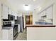 Bright kitchen features white cabinets, stainless steel appliances, and a functional layout at 4669 Stansbury Ln, Indianapolis, IN 46254