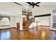 Beautiful living room area with a staircase and gleaming hardwood floors at 4669 Stansbury Ln, Indianapolis, IN 46254