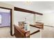 Upper loft area with stone fireplace feature and railing overlooking the living room at 4669 Stansbury Ln, Indianapolis, IN 46254