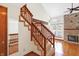 Wooden staircase with carpeting and wooden railing at 4669 Stansbury Ln, Indianapolis, IN 46254