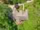 Expansive roof view of home featuring a private deck surrounded by lush greenery at 6012 Yellow Birch Ct, Avon, IN 46123