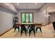 Bright basement dining area with rustic wood table and view to the outside at 6012 Yellow Birch Ct, Avon, IN 46123