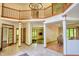 Spacious open-concept foyer with a chandelier and access to multiple living spaces at 6012 Yellow Birch Ct, Avon, IN 46123