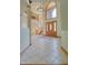 Grand foyer featuring a large arched doorway and open staircase at 6012 Yellow Birch Ct, Avon, IN 46123