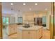 Bright kitchen with stainless steel appliances, granite countertops, and center island cooktop at 6012 Yellow Birch Ct, Avon, IN 46123