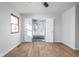 Bedroom with hardwood floors and double doors leading to bathroom at 6346 W 62Nd St, Indianapolis, IN 46278