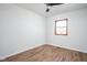 Bright bedroom featuring hardwood floors and a ceiling fan at 6346 W 62Nd St, Indianapolis, IN 46278