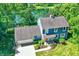 Charming blue home with attached garage, situated on a spacious lot near a pond at 635 Terrace Dr, Zionsville, IN 46077